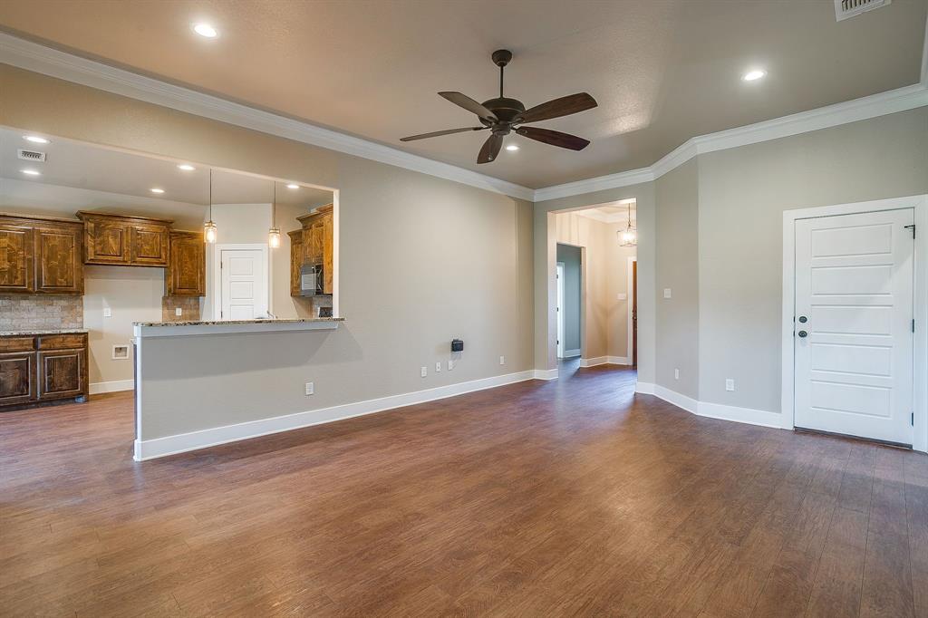 110 Hummingbird Drive Weatherford, TX 76085 - Photo 8 of 38 a view of an empty room with a kitchen