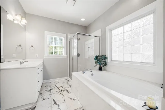 a bathroom with a bathtub and a sink