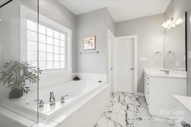 a bathroom with a bathtub and a sink