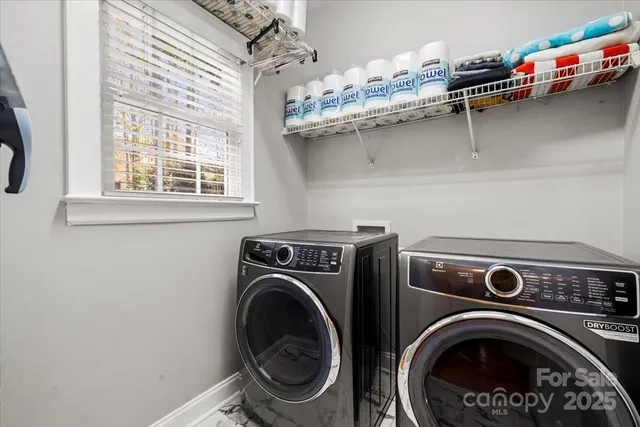 a utility room with dryer and washer