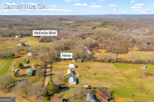 a view of a lake with a houses in the background