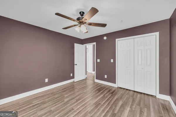 a view of an empty room and wooden floor