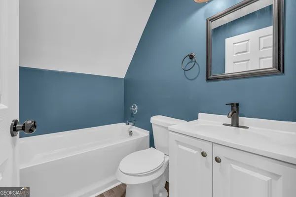 a bathroom with a sink toilet and a bathtub