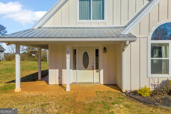 a front view of a house with garage