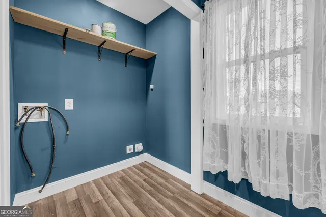 a view of a hallway with a chandelier fan
