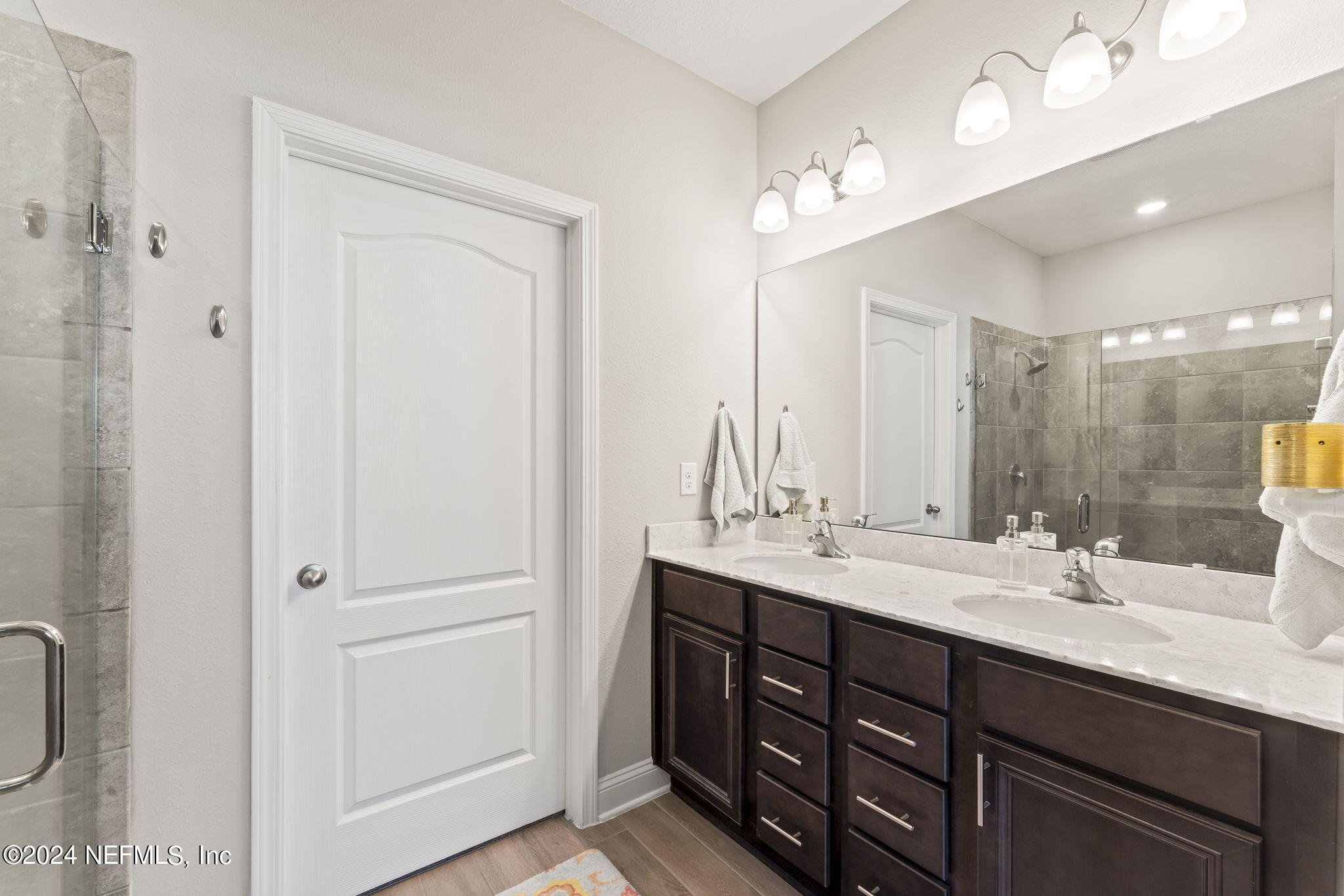 62 Thistleton Way Street St. Augustine, FL 32092 - Photo 15 of 29 a bathroom with double vanity sinks and a mirror