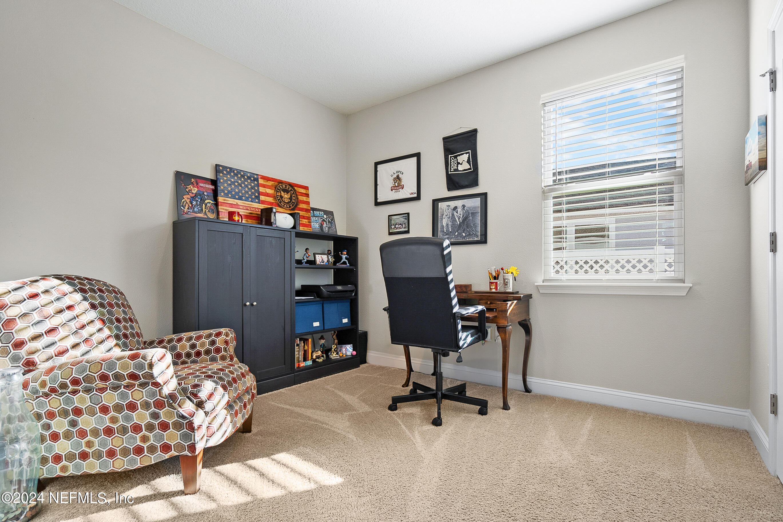 62 Thistleton Way Street St. Augustine, FL 32092 - Photo 16 of 29 a view of a workspace with furniture and a window