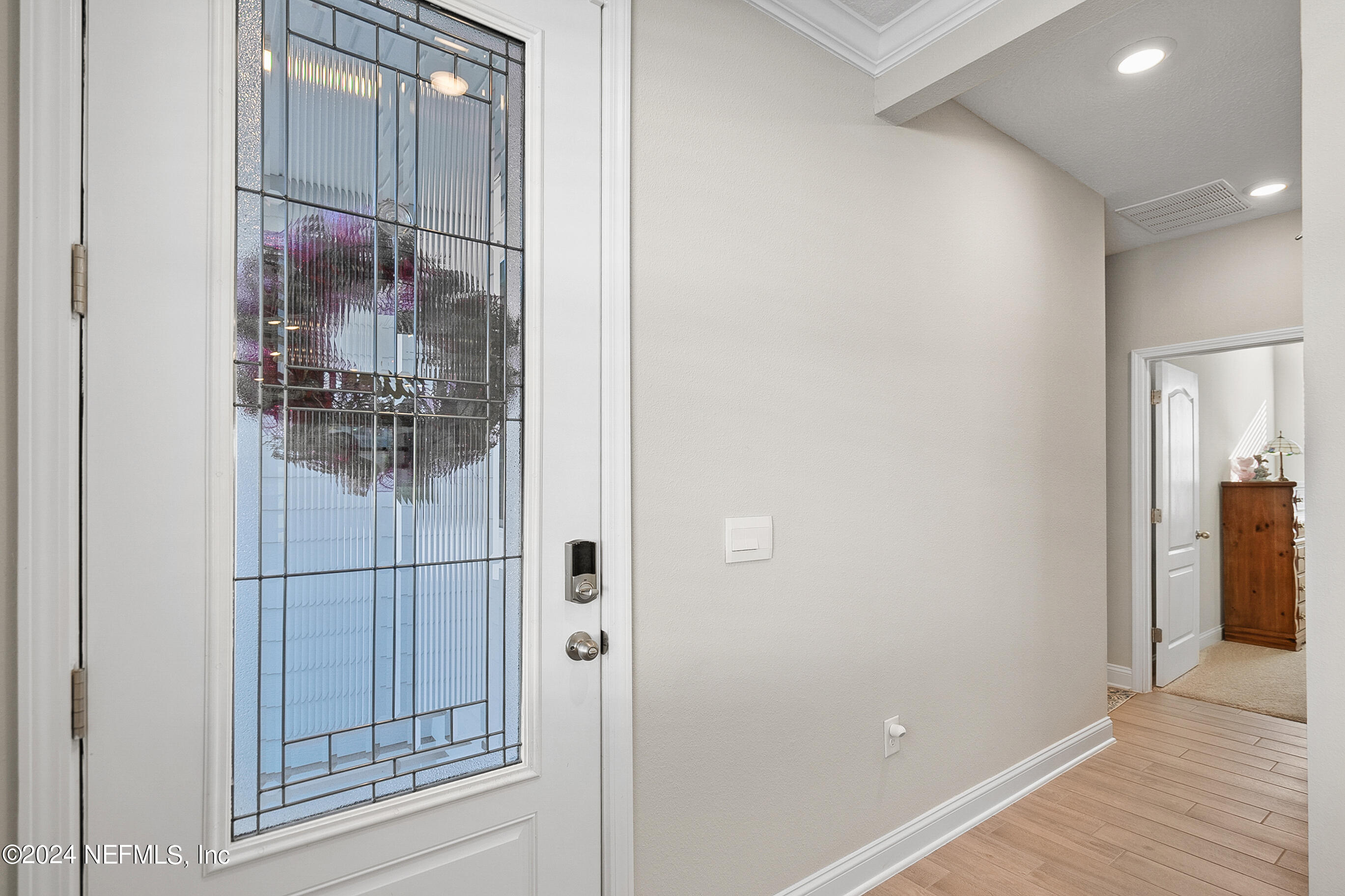 62 Thistleton Way Street St. Augustine, FL 32092 - Photo 5 of 29 a bathroom with a glass shower door and mirror