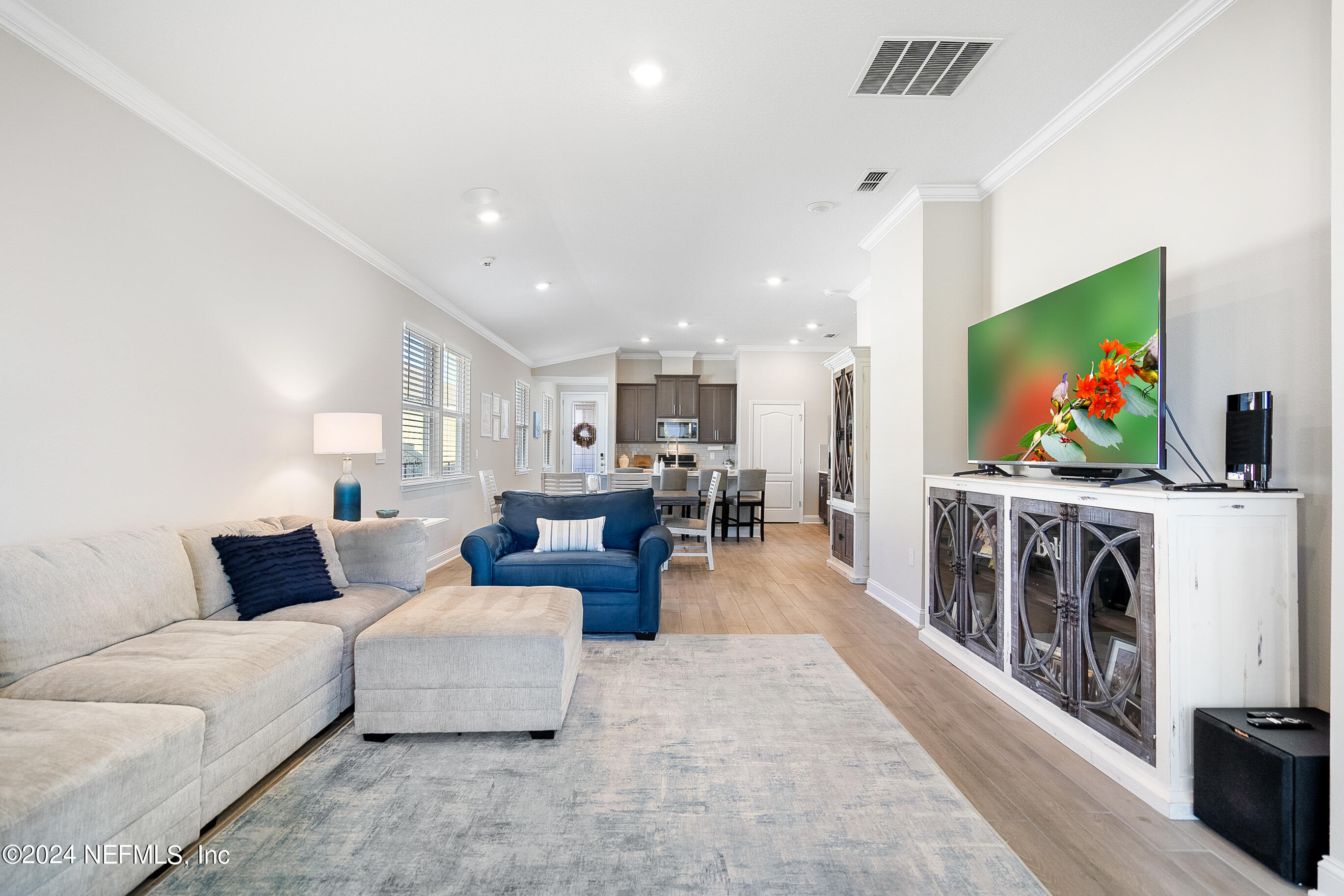 62 Thistleton Way Street St. Augustine, FL 32092 - Photo 9 of 29 a living room with furniture and a flat screen tv
