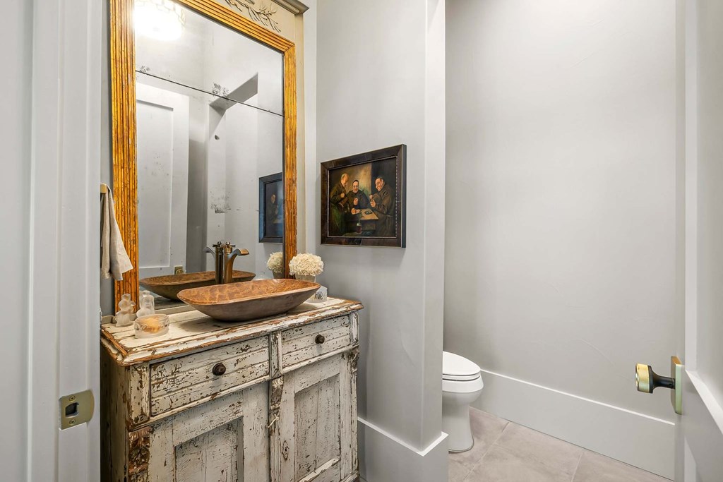 371 Achtzehn Road Fredericksburg, TX 78624 - Photo 22 of 41 a bathroom with a granite countertop sink toilet and mirror
