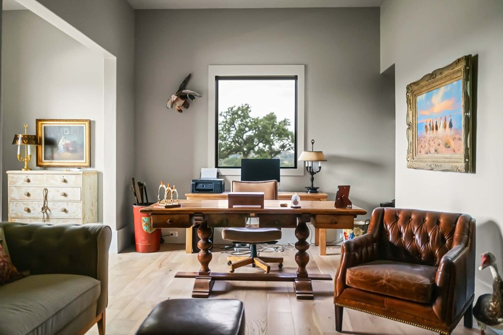 371 Achtzehn Road Fredericksburg, TX 78624 - Photo 27 of 41 a living room with furniture and a large window