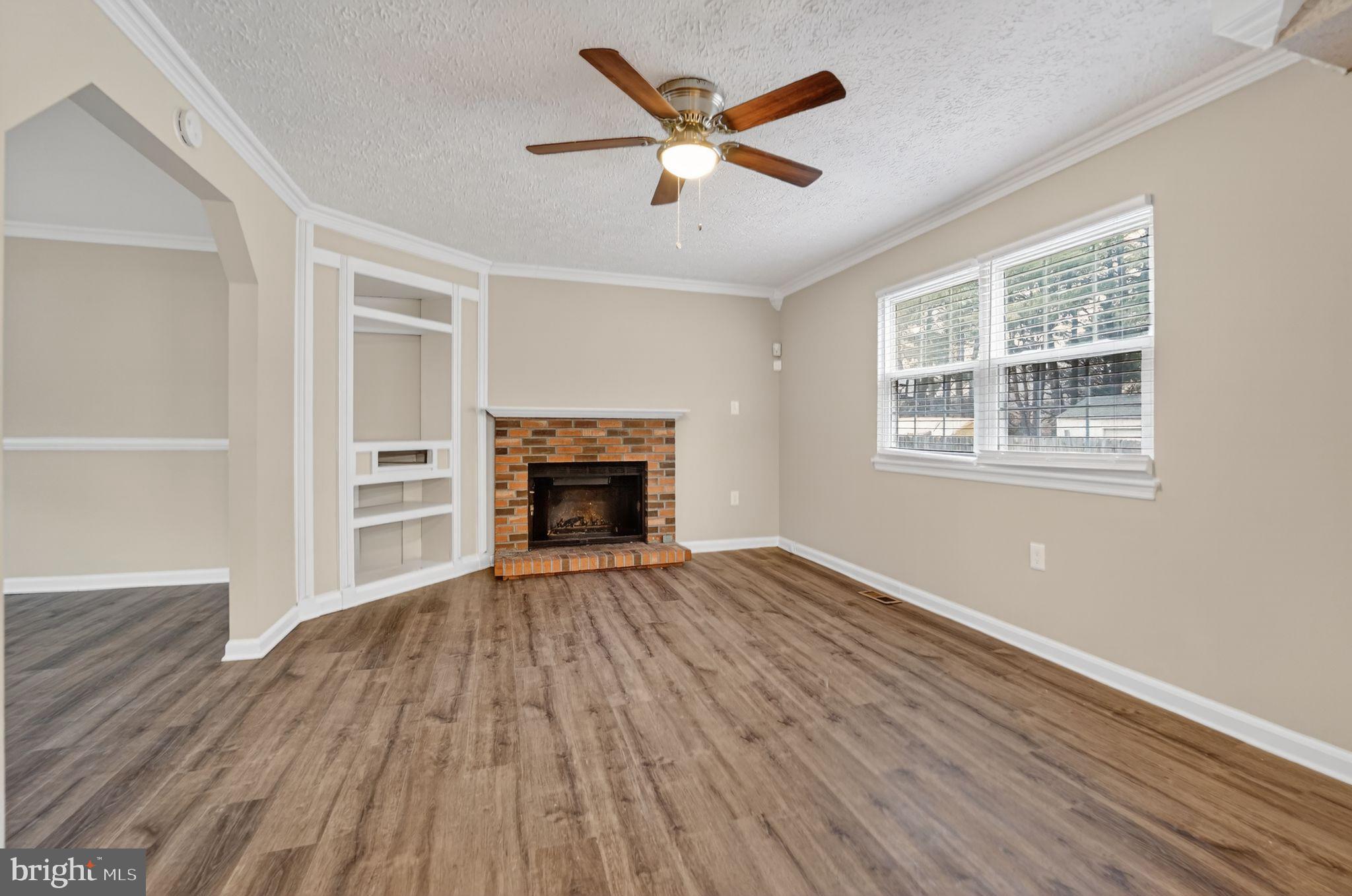 5904 Mardella Boulevard Clinton, MD 20735 - Photo 4 of 34 wooden floor in an empty room with a window