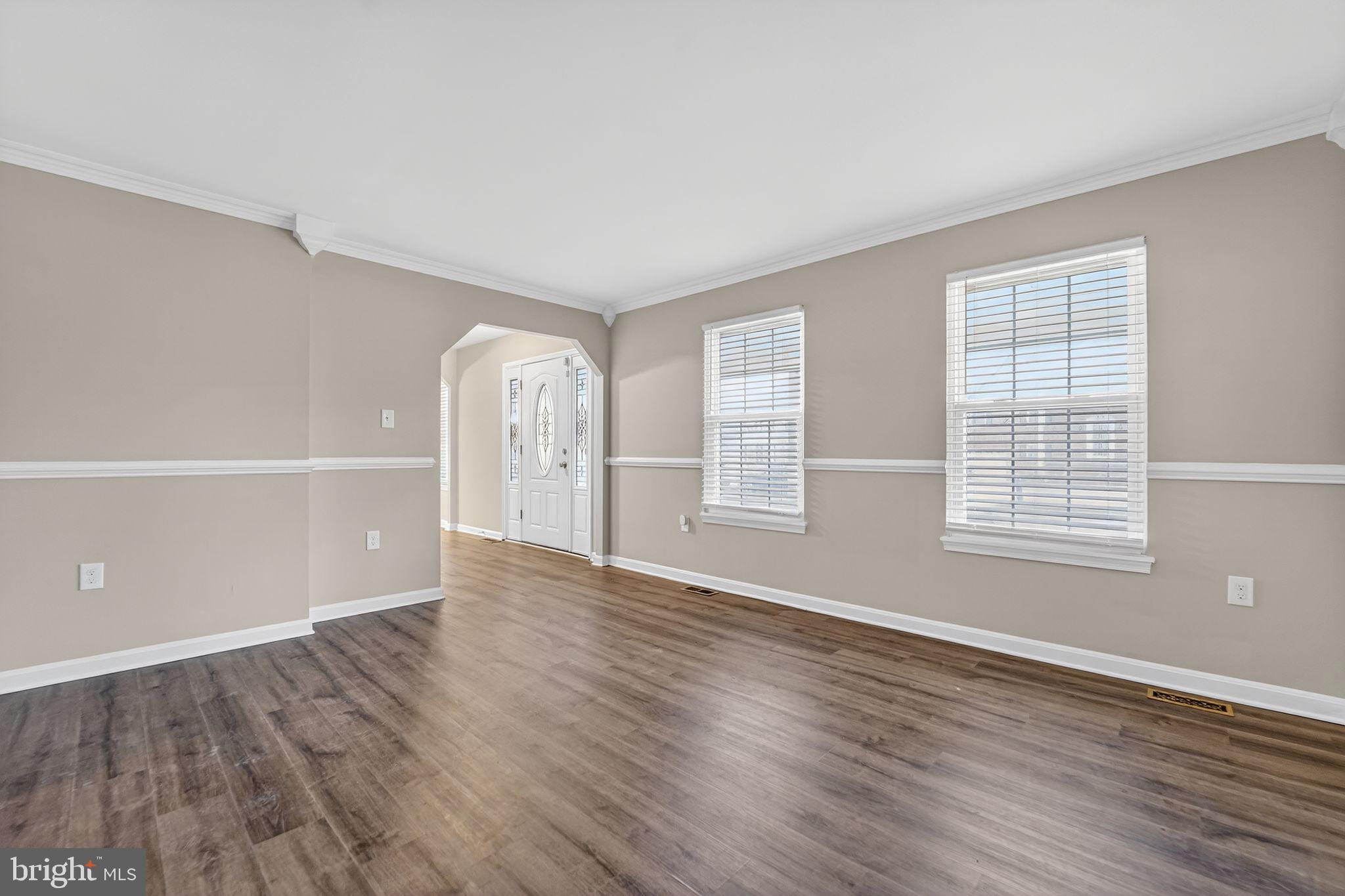 5904 Mardella Boulevard Clinton, MD 20735 - Photo 5 of 34 an empty room with wooden floor and windows