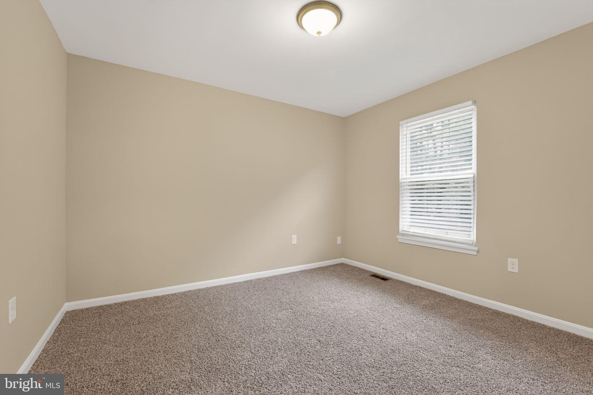 5904 Mardella Boulevard Clinton, MD 20735 - Photo 9 of 34 a view of an empty room with a window