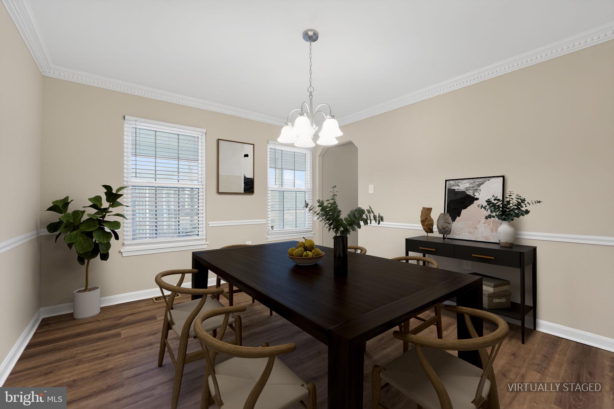 5904 Mardella Boulevard Clinton, MD 20735 - Photo 10 of 34 a view of a dining room with furniture window and wooden floor