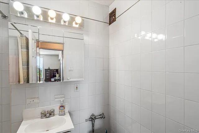 a spacious bedroom with a bed and a large window