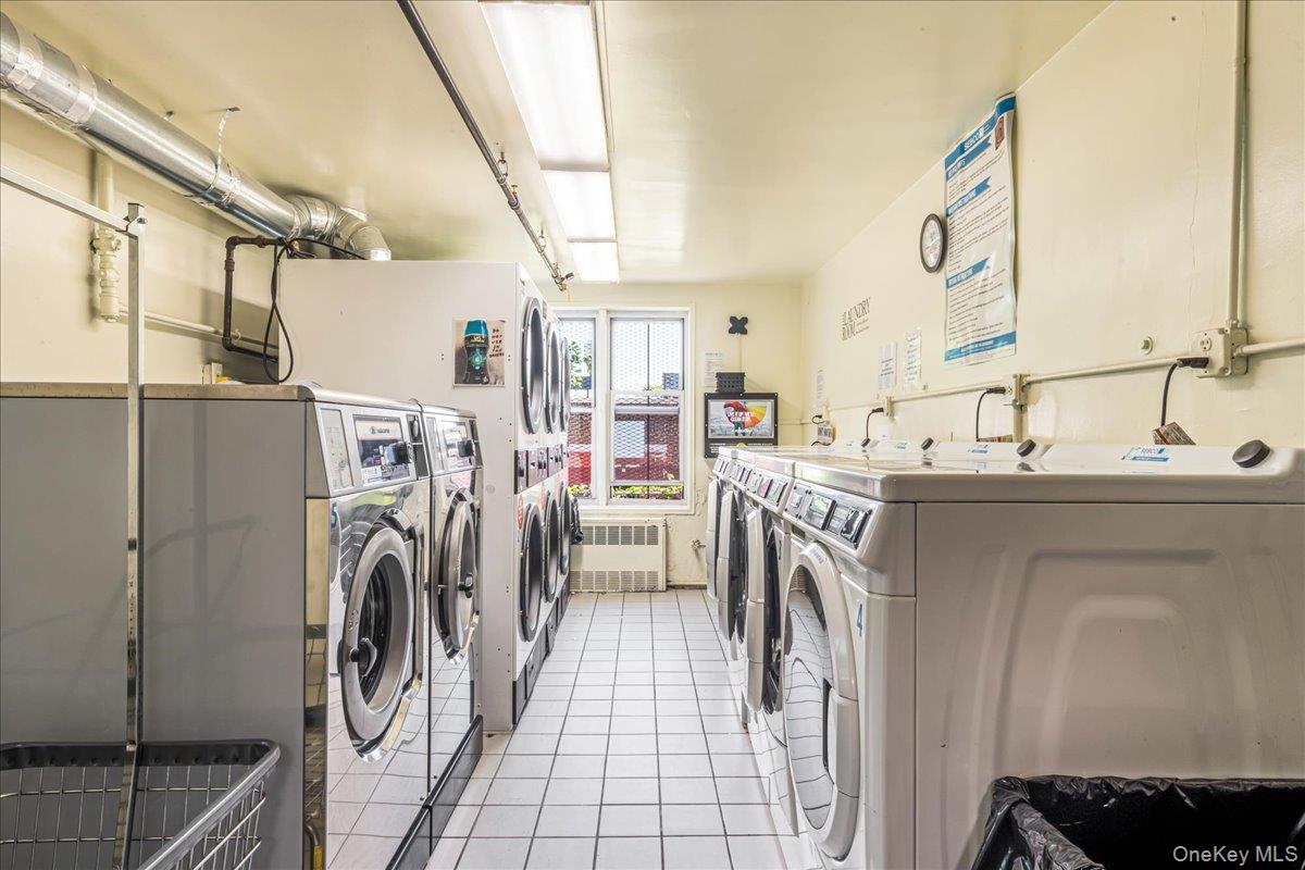 151-05 Cross Island Parkway, Unit 6C Queens, NY 11357 - Photo 18 of 20 a utility room with dryer and washer