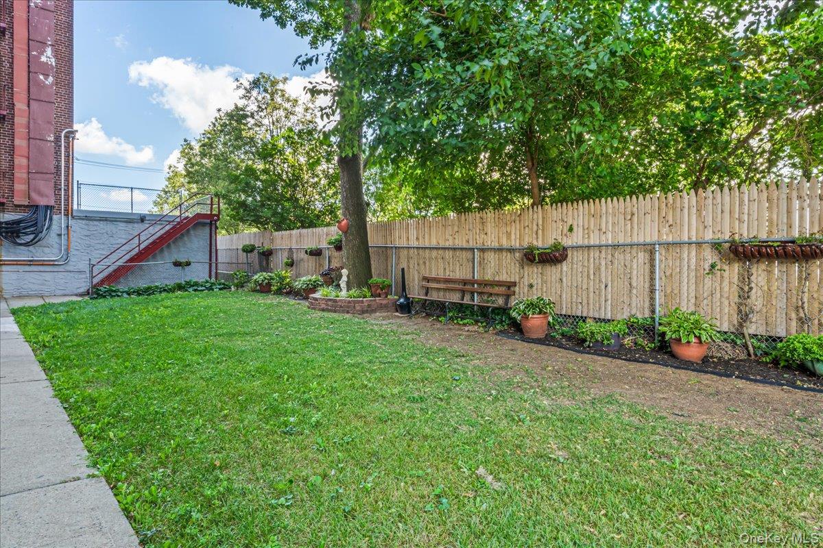 151-05 Cross Island Parkway, Unit 6C Queens, NY 11357 - Photo 19 of 20 a view of a backyard with a garden