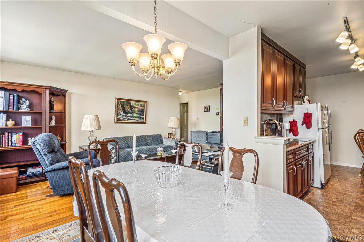 151-05 Cross Island Parkway, Unit 6C Queens, NY 11357 - Photo 9 of 20 a view of a dining room with furniture