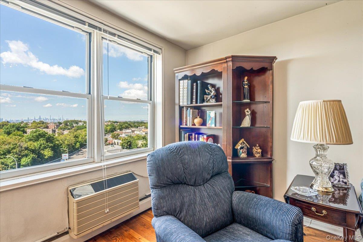 151-05 Cross Island Parkway, Unit 6C Queens, NY 11357 - Photo 10 of 20 a living room with furniture and a window