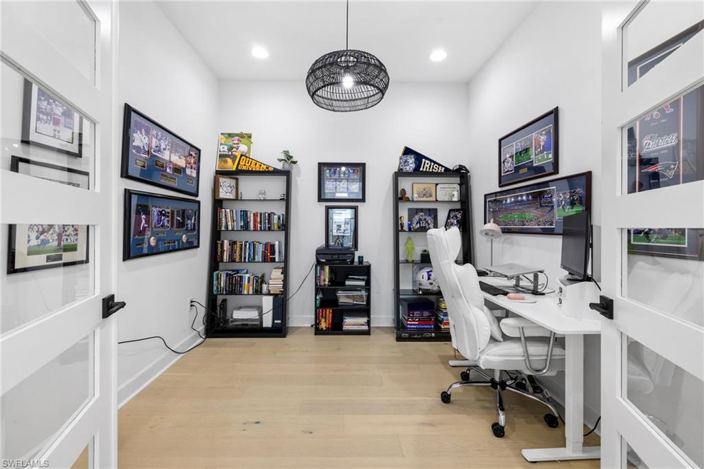 6291 Arriba Avenue Naples, FL 34113 - Photo 15 of 43 a view of a workspace with furniture