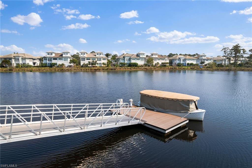 6291 Arriba Avenue Naples, FL 34113 - Photo 26 of 43 a view of a lake with houses