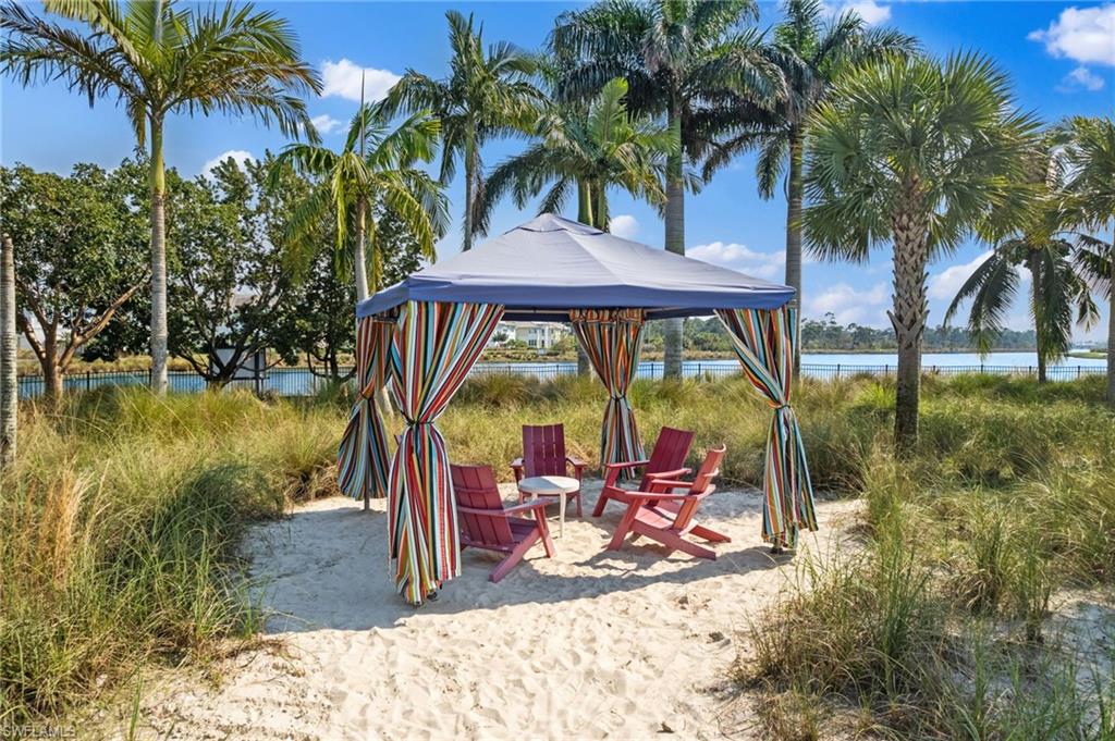 6291 Arriba Avenue Naples, FL 34113 - Photo 28 of 43 a view of swimming pool with a patio and lake view