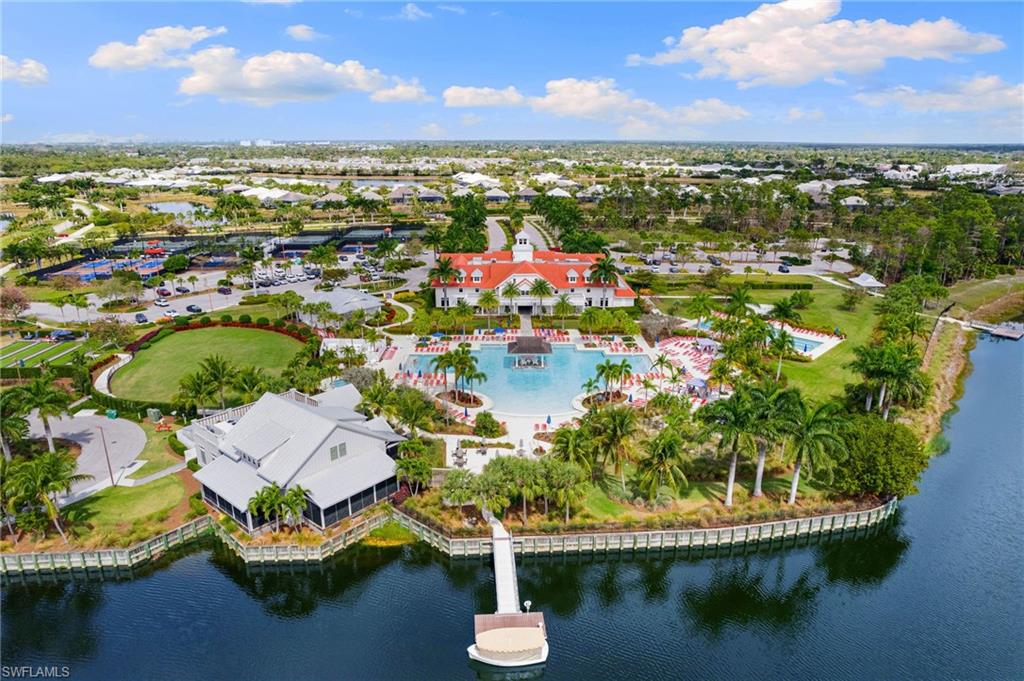6291 Arriba Avenue Naples, FL 34113 - Photo 33 of 43 a view of a lake with a city