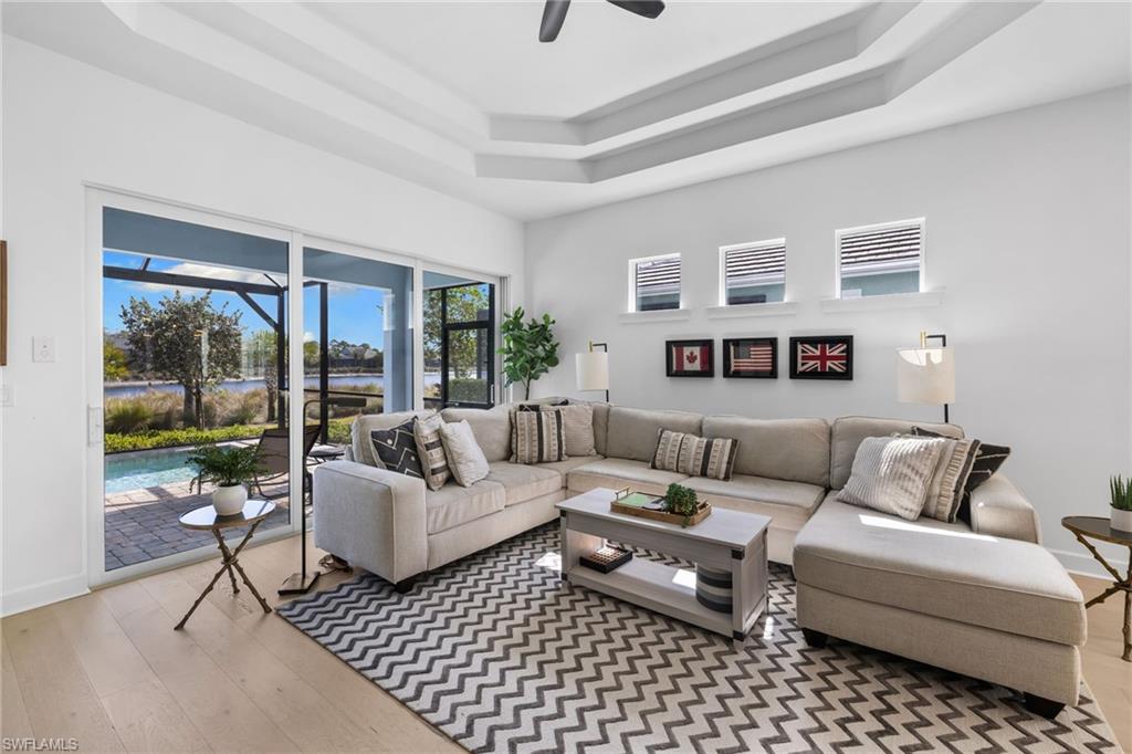 6291 Arriba Avenue Naples, FL 34113 - Photo 4 of 43 a living room with furniture and a window