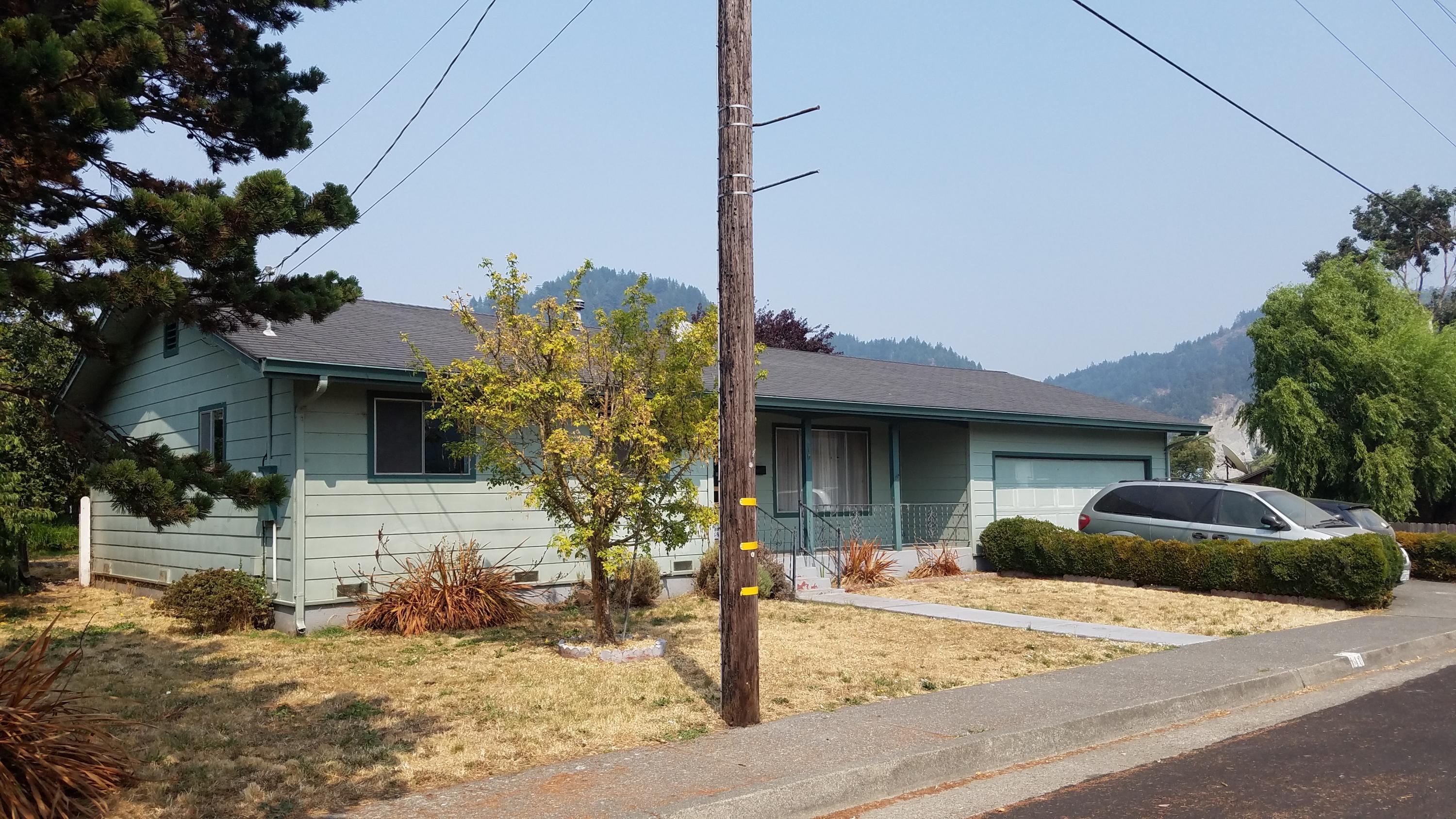 110 Davis Street Rio Dell, CA 95562 - Photo 1 of 1 a front view of a house with garden