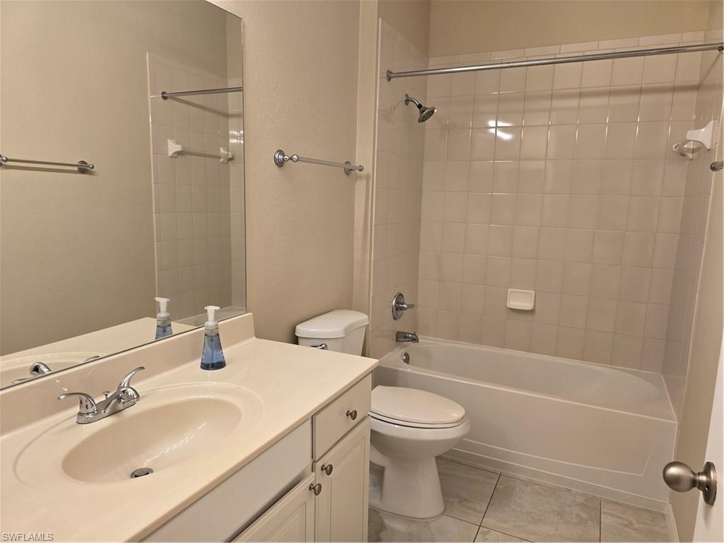 1020 Peggy Circle, Unit 101 Naples, FL 34113 - Photo 19 of 30 a bathroom with a sink toilet and shower