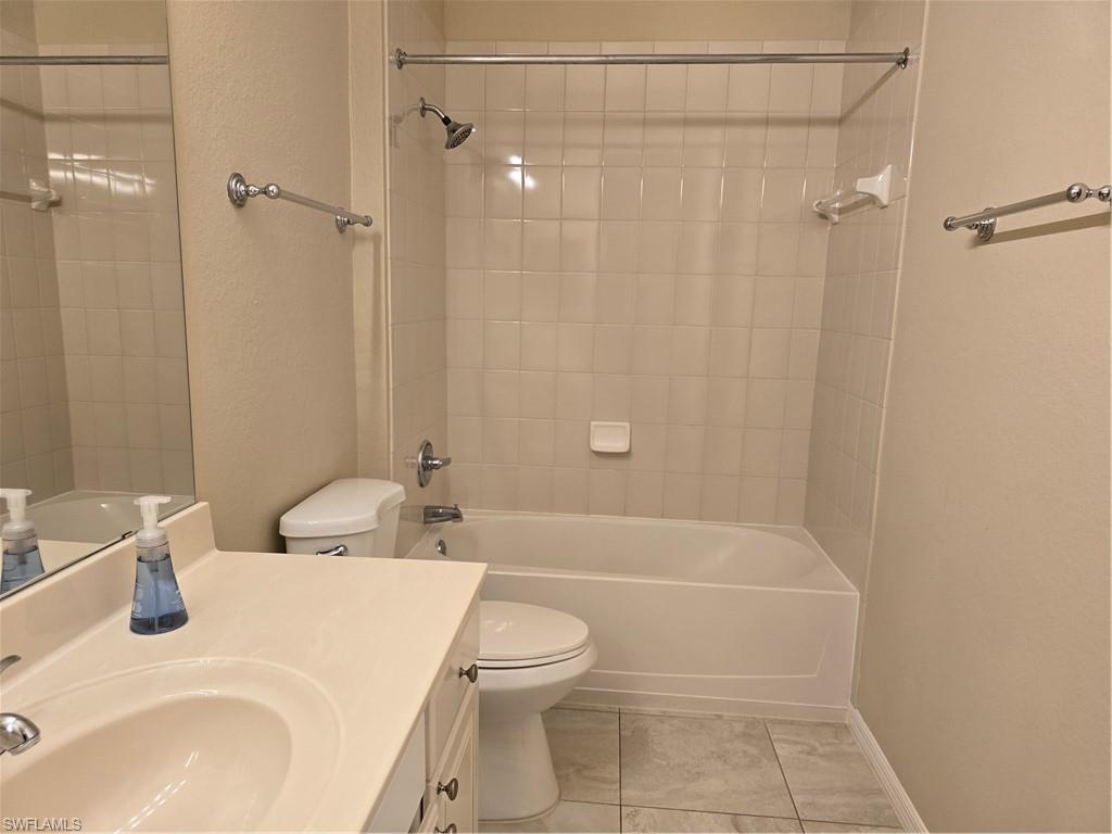 1020 Peggy Circle, Unit 101 Naples, FL 34113 - Photo 21 of 30 a bathroom with a sink a toilet and shower