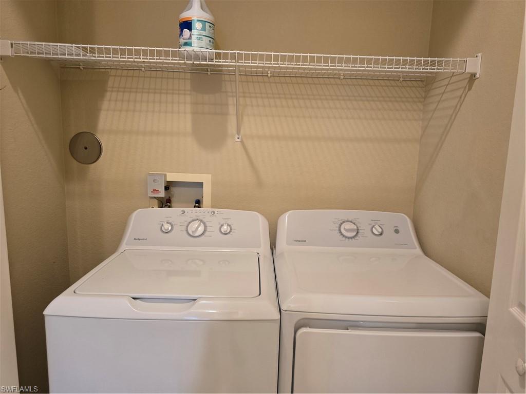 1020 Peggy Circle, Unit 101 Naples, FL 34113 - Photo 23 of 30 a utility room with dryer and washer