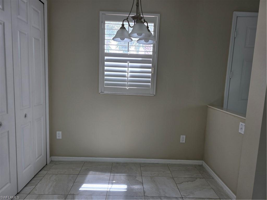 1020 Peggy Circle, Unit 101 Naples, FL 34113 - Photo 24 of 30 a view of empty room with window