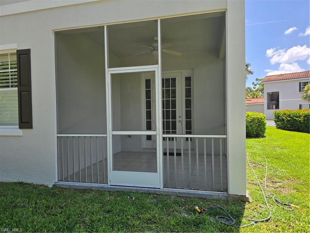 1020 Peggy Circle, Unit 101 Naples, FL 34113 - Photo 26 of 30 a view of outdoor space with garden