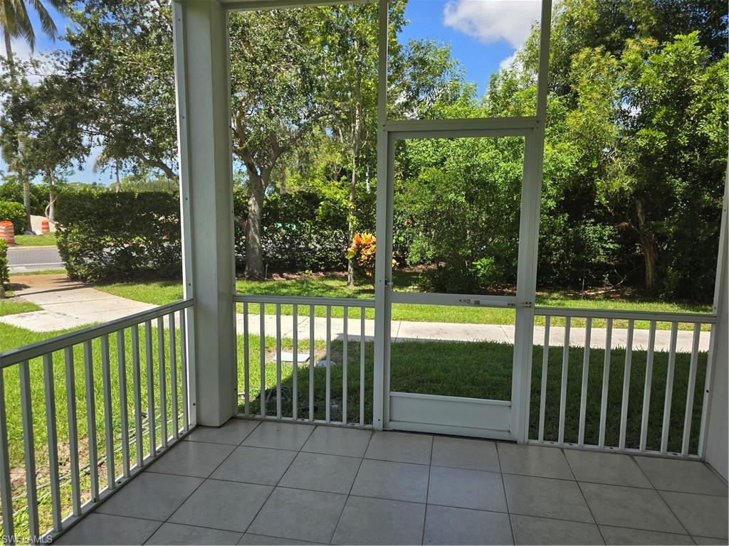 1020 Peggy Circle, Unit 101 Naples, FL 34113 - Photo 27 of 30 a view of backyard from a balcony