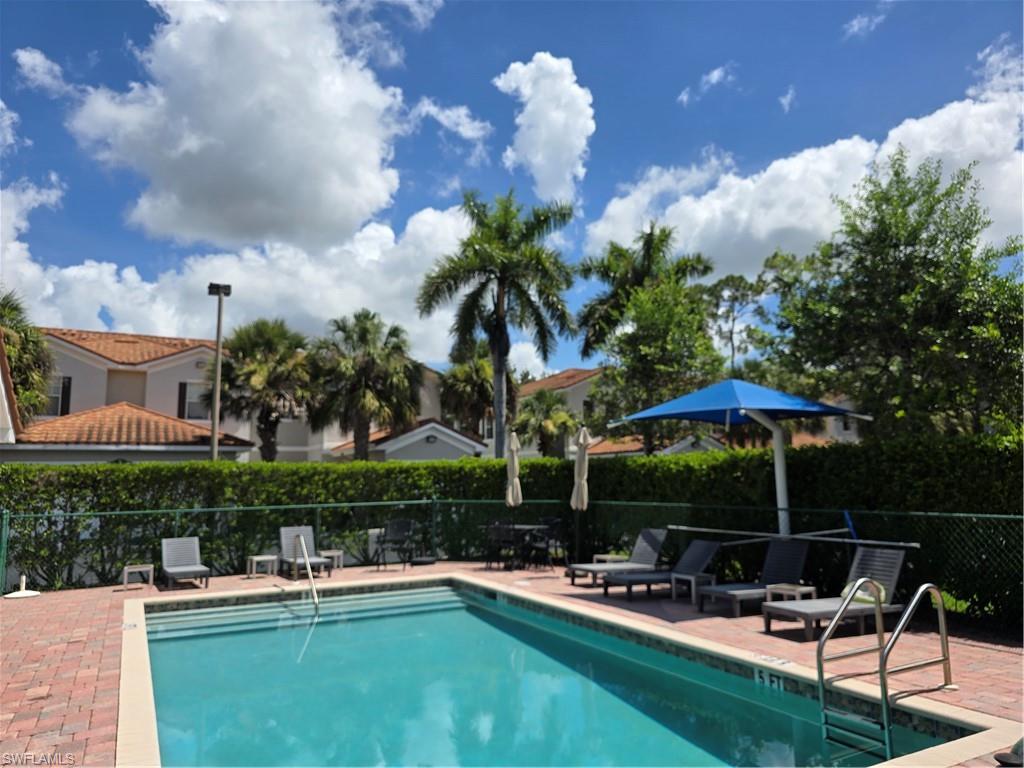 1020 Peggy Circle, Unit 101 Naples, FL 34113 - Photo 30 of 30 a view of a house with backyard porch and sitting area
