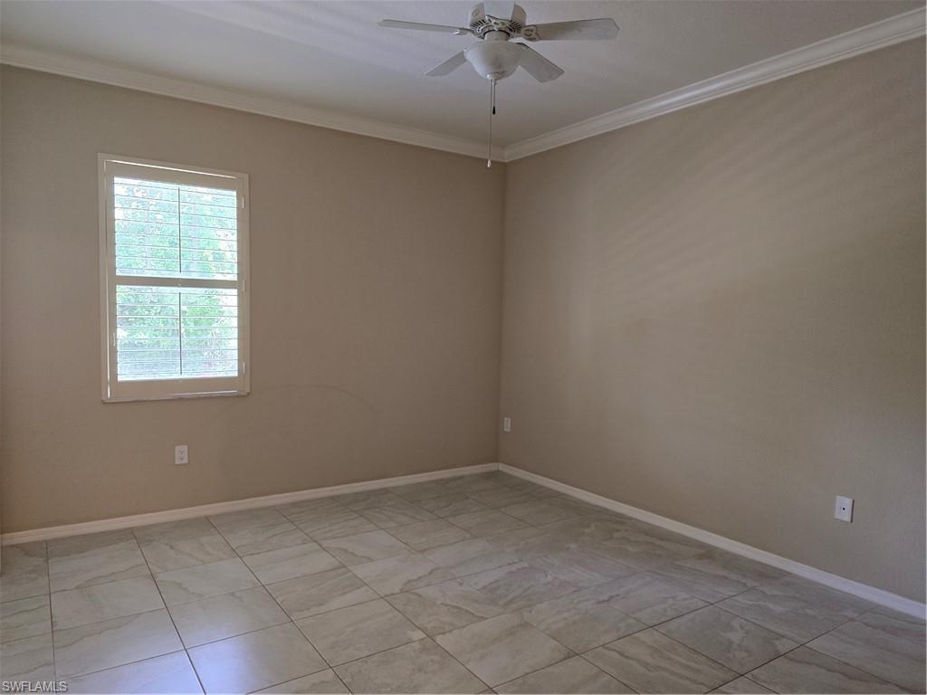 1020 Peggy Circle, Unit 101 Naples, FL 34113 - Photo 10 of 30 an empty room with a window