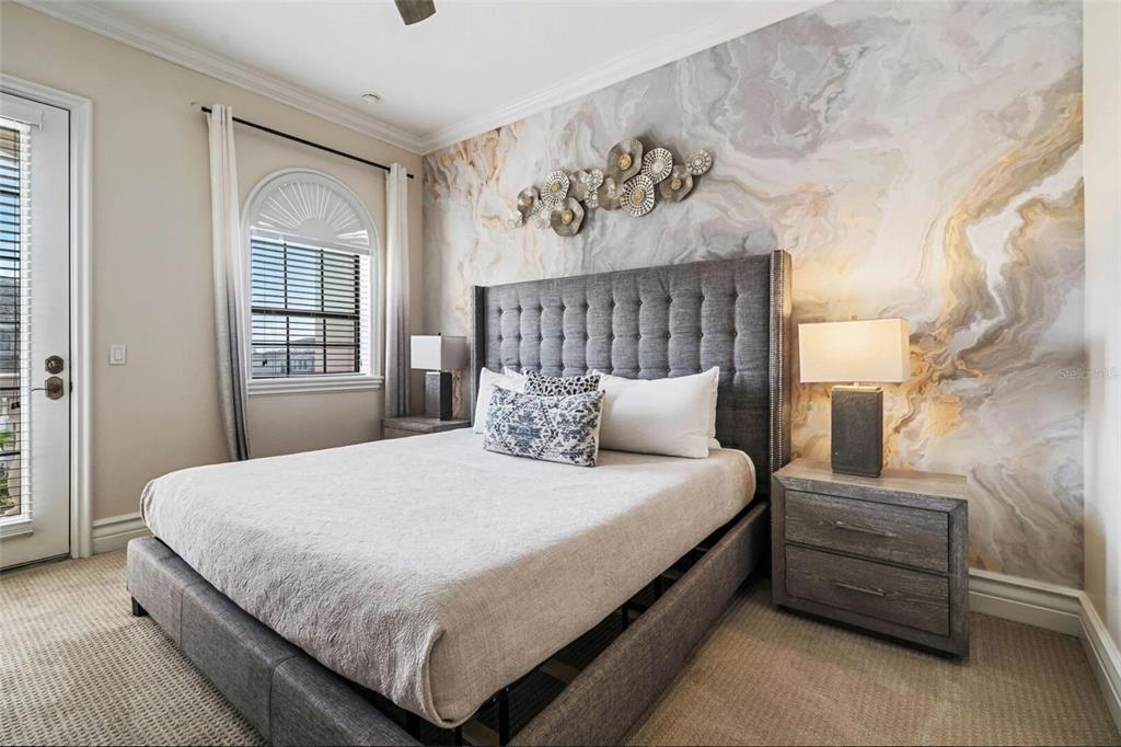 304 Muirfield Loop Reunion, FL 34747 - Photo 23 of 85 a bedroom with a bed and window