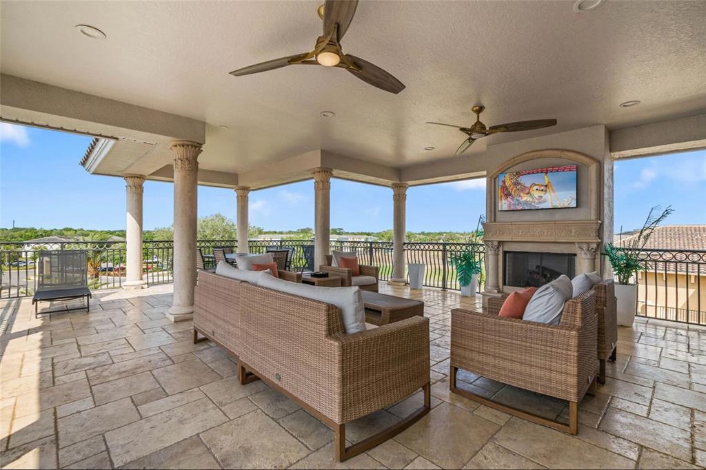 304 Muirfield Loop Reunion, FL 34747 - Photo 54 of 85 a living room with fireplace furniture and a large window