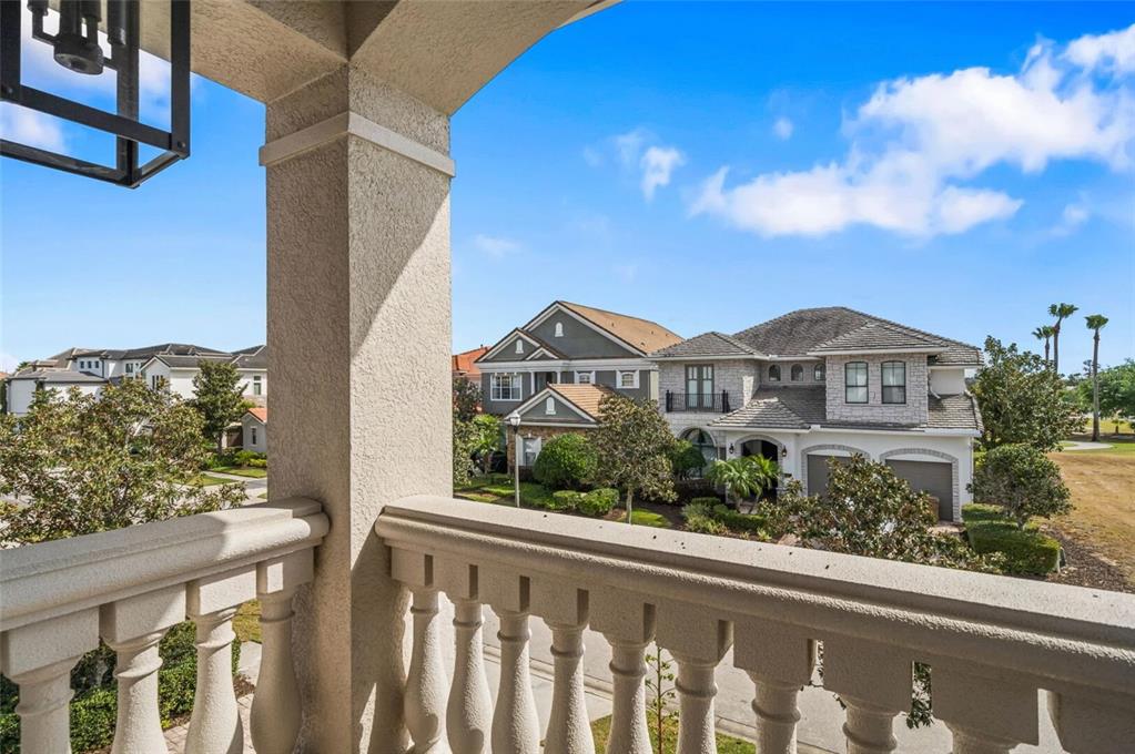 304 Muirfield Loop Reunion, FL 34747 - Photo 75 of 85 a view of a house with a small yard and wooden fence