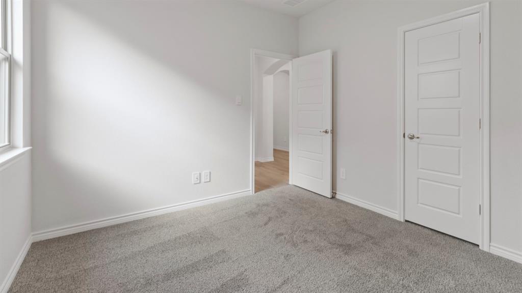 510 Range Road Caddo Mills, TX 75135 - Photo 5 of 25 Unfurnished bedroom featuring carpet floors and baseboards
