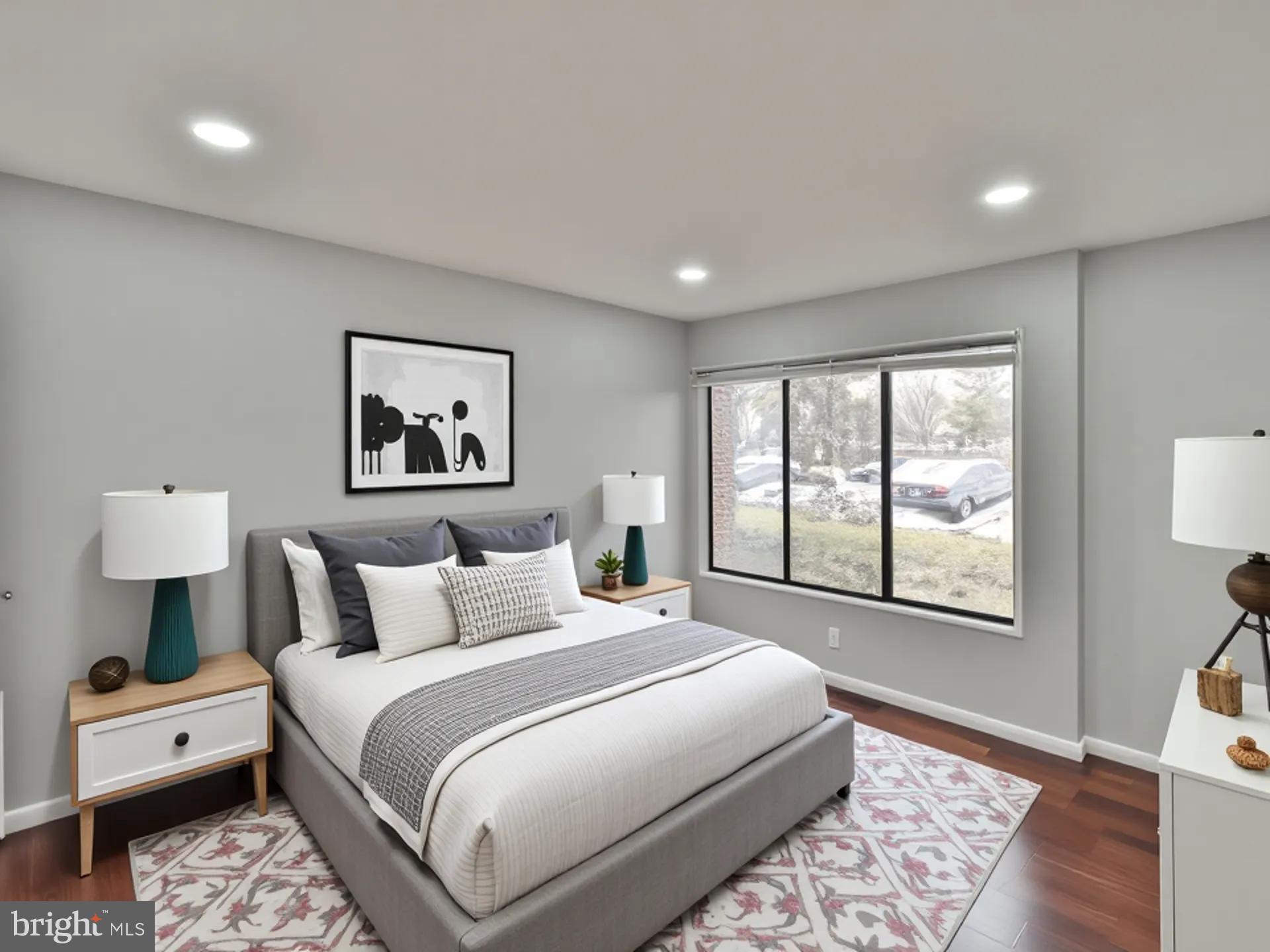 15712 Dorset Road, Unit 104 Laurel, MD 20707 - Photo 25 of 49 a bedroom with a large bed and a window