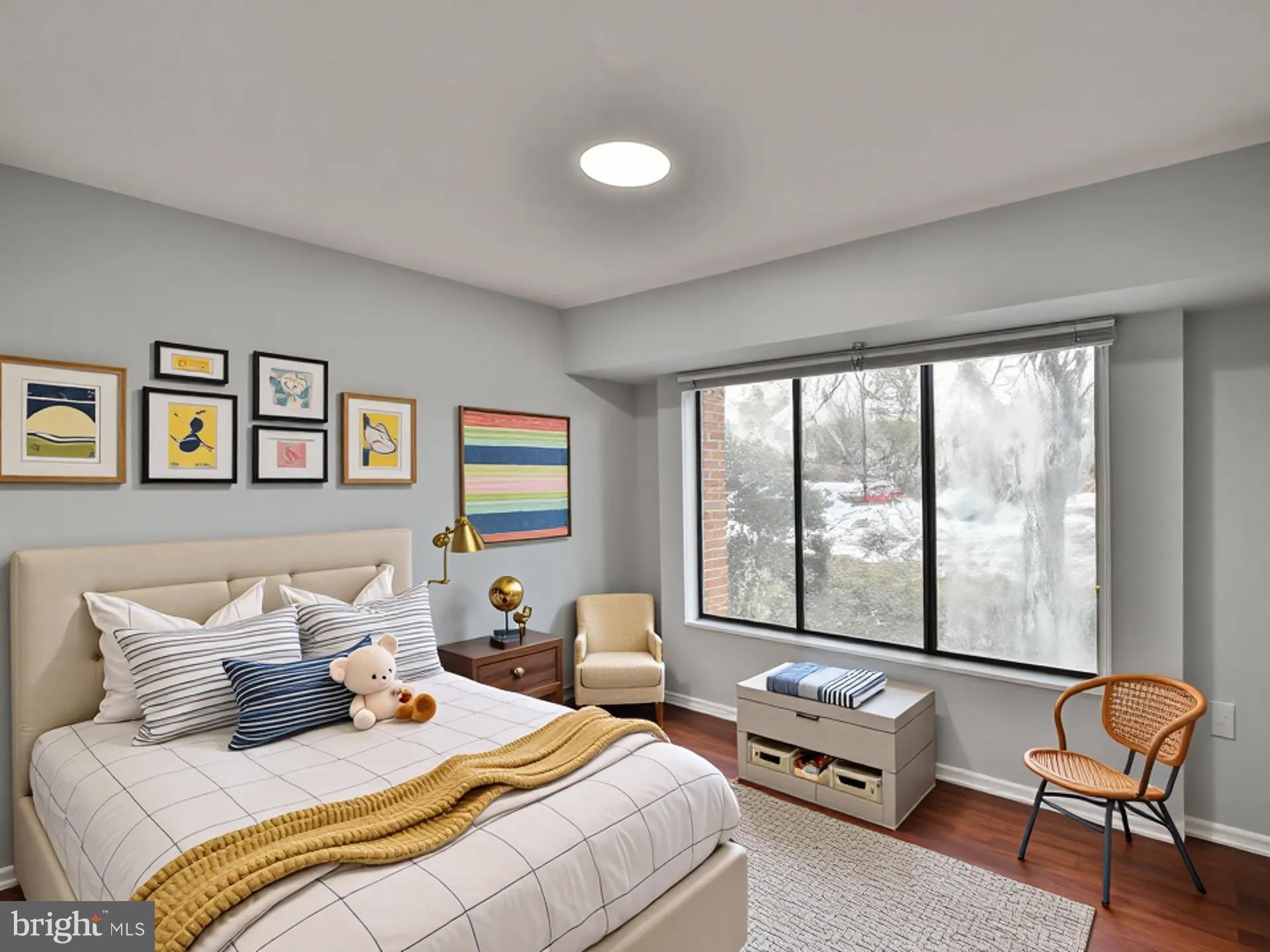 15712 Dorset Road, Unit 104 Laurel, MD 20707 - Photo 31 of 49 a bedroom with bed and large windows