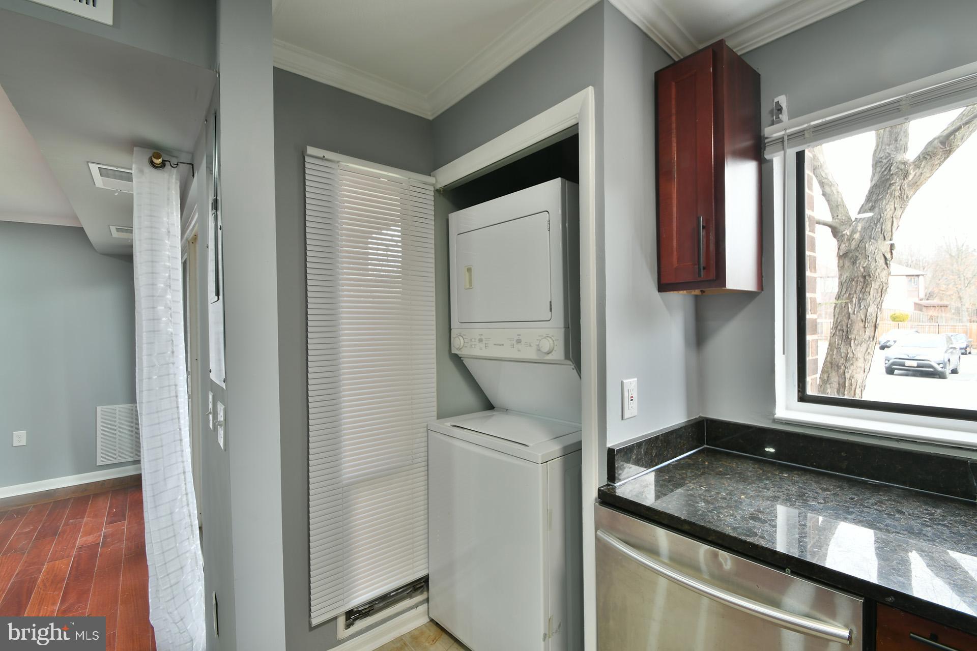 15712 Dorset Road, Unit 104 Laurel, MD 20707 - Photo 38 of 49 a bathroom with a granite countertop sink and a mirror