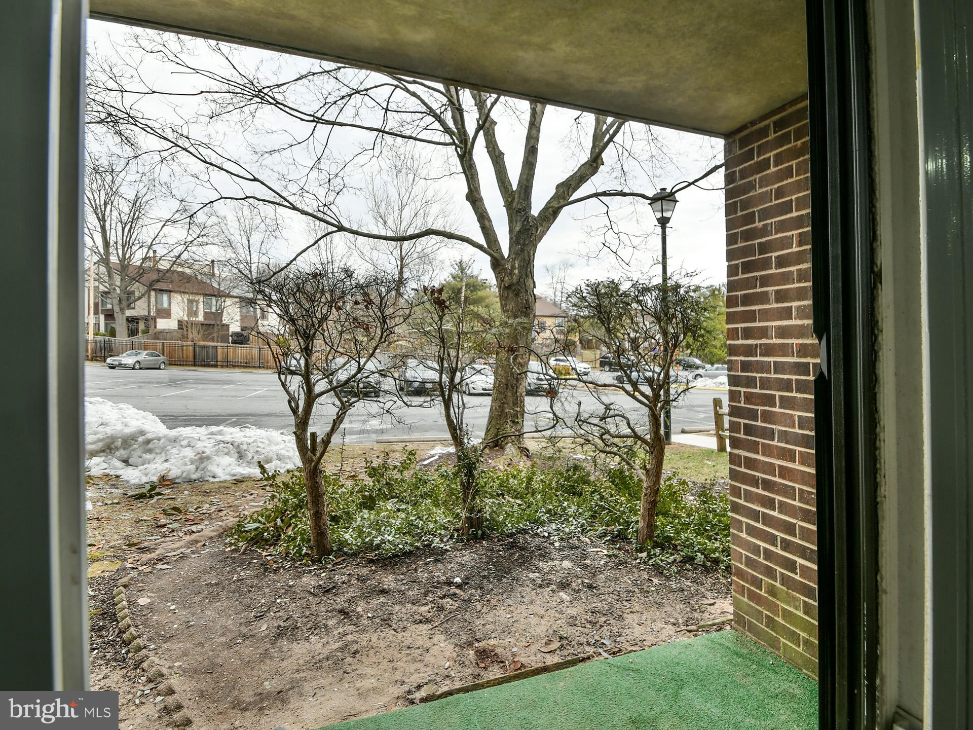 15712 Dorset Road, Unit 104 Laurel, MD 20707 - Photo 39 of 49 a view of a yard with a tree