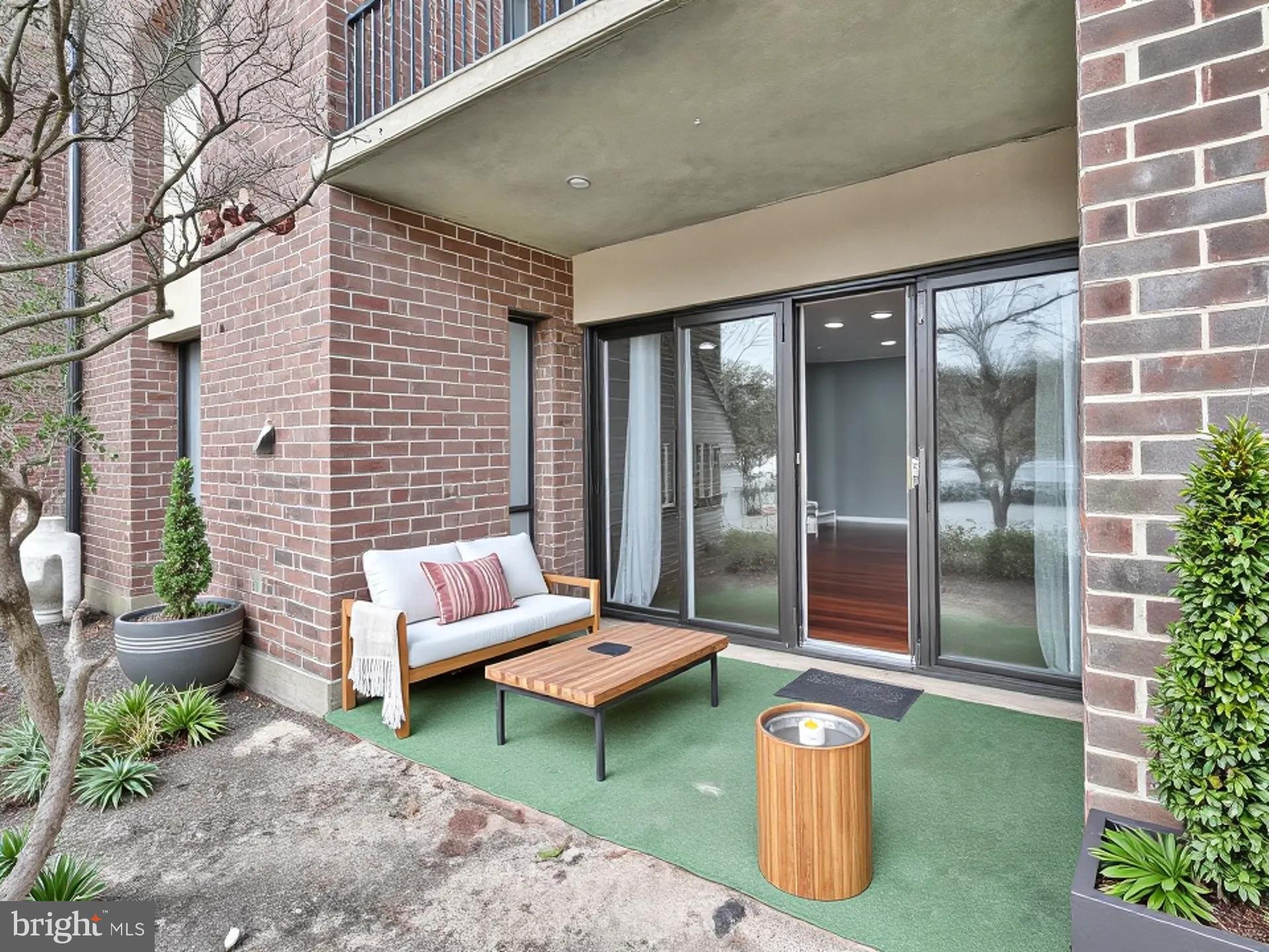 15712 Dorset Road, Unit 104 Laurel, MD 20707 - Photo 41 of 49 a backyard of a house with seating space