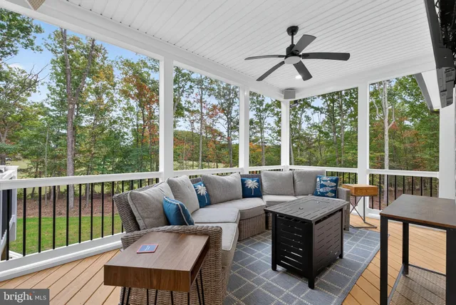 a view of a patio with a table chairs and a umbrella