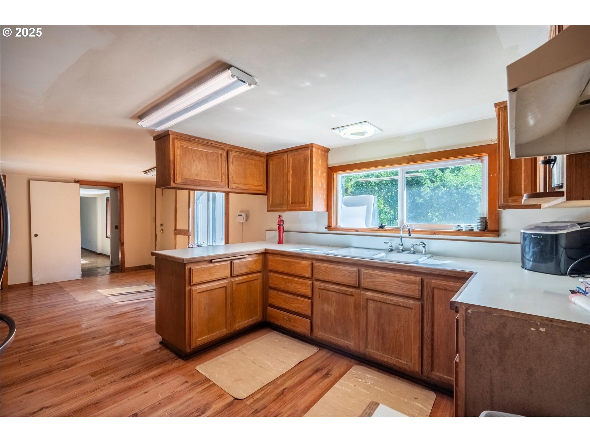 87720 Two Mile Lane Bandon, OR 97411 - Photo 10 of 35 a kitchen with granite countertop a sink stainless steel appliances and cabinets