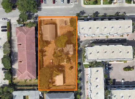 aerial view of a house with a lot of cars